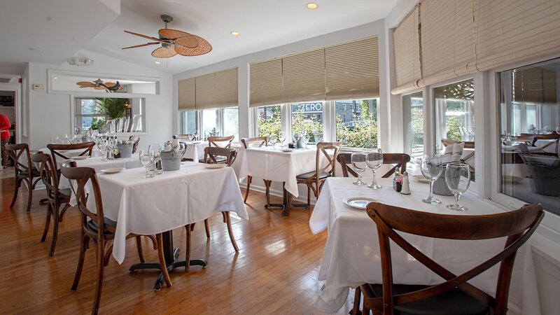 Dining room with set tables with white table cloths
