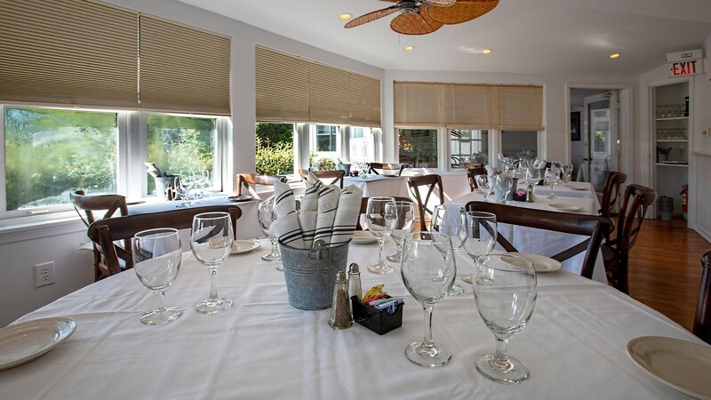 Dining room with focus on table set for four
