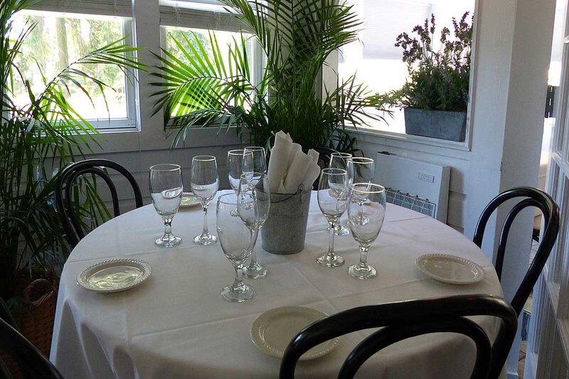 Dining room table set for four with ice bucket in a the center
