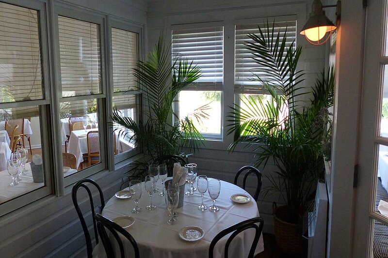 Dining room with round table set for four